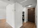 Clean entryway leading to the kitchen with modern appliances and ample space at 7755 E Quincy Ave # 203A2, Denver, CO 80237