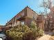 Exterior view of the building with greenery at 7755 E Quincy Ave # 203A2, Denver, CO 80237
