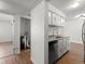 Updated kitchen with new stainless steel appliances and cabinetry, adjacent to laundry room at 7755 E Quincy Ave # 203A2, Denver, CO 80237