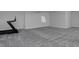 Spacious basement featuring neutral-toned carpet and a treadmill for a home gym at 1160 Spencer Pl, Erie, CO 80026
