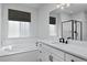 Modern bathroom with soaking tub, separate shower, and vanity at 1160 Spencer Pl, Erie, CO 80026
