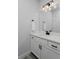 Modern bathroom featuring a white vanity and dark hardware for a sleek style at 1160 Spencer Pl, Erie, CO 80026