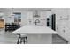Bright kitchen with a large island, ample counter space, and modern finishes, adjacent to breakfast nook at 1160 Spencer Pl, Erie, CO 80026