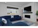 Spacious living room with large sectional sofa, fireplace, and TV at 1160 Spencer Pl, Erie, CO 80026