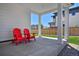 Cozy covered patio with seating, overlooking a lush green lawn and privacy fence at 1160 Spencer Pl, Erie, CO 80026