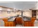 Basement bar with sink and tile backsplash at 730 Crescent Ln, Lakewood, CO 80214