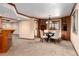 Basement dining area with table and cabinetry at 730 Crescent Ln, Lakewood, CO 80214