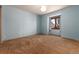 Light blue bedroom with a window that allows natural light to illuminate the room and its features at 730 Crescent Ln, Lakewood, CO 80214