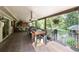 This covered deck features a built-in grill and food prep area, with views of the lush surroundings at 730 Crescent Ln, Lakewood, CO 80214