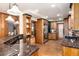 Kitchen features wood cabinetry, granite countertops, stainless steel appliances, and hardwood floors at 730 Crescent Ln, Lakewood, CO 80214