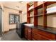Well-appointed laundry room with storage, sink, and modern washer and dryer at 730 Crescent Ln, Lakewood, CO 80214