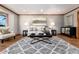 Cozy living room boasts hardwood floors, neutral walls, plush seating, and stylish decor at 730 Crescent Ln, Lakewood, CO 80214