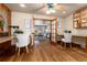 Bright office with hardwood floors, built-in desks, and French doors that open to the living room at 730 Crescent Ln, Lakewood, CO 80214