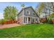 Spacious backyard with lush green lawn, patio, and a firepit, perfect for outdoor entertaining at 1101 Ridgeview Cir, Broomfield, CO 80020