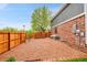 Cozy backyard space with a firepit, gravel, and a wooden fence for privacy at 1101 Ridgeview Cir, Broomfield, CO 80020
