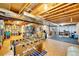 Unfinished basement with exposed wood, a foosball table, and plenty of space for storage and recreation at 1101 Ridgeview Cir, Broomfield, CO 80020