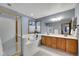 Bathroom with double vanity, tub and shower enclosed with a gold frame at 1101 Ridgeview Cir, Broomfield, CO 80020