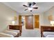 Bedroom showcasing twin beds and wood trim at 1101 Ridgeview Cir, Broomfield, CO 80020