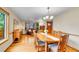 Elegant dining room with hardwood floors connecting to living room and front entrance at 1101 Ridgeview Cir, Broomfield, CO 80020