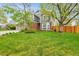 Charming two-story home with a well-maintained lawn, mature trees, brick accents, and a welcoming presence at 1101 Ridgeview Cir, Broomfield, CO 80020