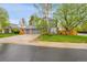 Beautiful two-story home with a gray exterior, brick accents, a well-manicured lawn, and a three car garage at 1101 Ridgeview Cir, Broomfield, CO 80020
