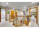 Upstairs hallway with wood and iron railings, views of the foyer, and easy access to rooms at 1101 Ridgeview Cir, Broomfield, CO 80020