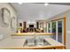 Open floor plan from the kitchen to the living room with a fireplace at 1101 Ridgeview Cir, Broomfield, CO 80020