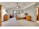Spacious main bedroom boasts a vaulted ceiling, natural light, wood furniture and ensuite bathroom at 1101 Ridgeview Cir, Broomfield, CO 80020