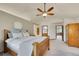 Large main bedroom with a wooden bed frame and ensuite bathroom at 1101 Ridgeview Cir, Broomfield, CO 80020