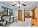 Well-lit office with a large window, a closet for storage, and adjacent living area at 1101 Ridgeview Cir, Broomfield, CO 80020