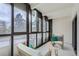 Balcony with outdoor seating and views of mature trees, great for relaxing and entertaining at 800 Pearl St # 204, Denver, CO 80203