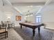 Game room with a pool table, bar seating, accent lighting, and neutral carpeting at 800 Pearl St # 204, Denver, CO 80203