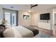 Bright primary bedroom featuring sliding glass doors, hardwood floors and large windows at 800 Pearl St # 204, Denver, CO 80203