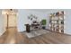Home office space with a work desk, stylish bookshelf and neutral colors, in a well-lit room at 800 Pearl St # 204, Denver, CO 80203