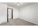 Inviting bedroom with carpet, features a modern door and overhead lighting at 8736 E Easter Ave, Centennial, CO 80112