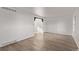 Well-lit living room with wood-look floors and an arched entryway at 8736 E Easter Ave, Centennial, CO 80112