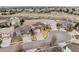 Wide aerial view of a home on a cul-de-sac lot nestled in a neighborhood with open space at 1015 Graland Pl, Highlands Ranch, CO 80126
