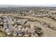 Wide aerial view of a large neighborhood with sprawling homes and lots of beautiful green space at 1015 Graland Pl, Highlands Ranch, CO 80126