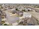 Spacious community showcasing well-maintained homes on winding roads, surrounded by open land and scenic views at 1015 Graland Pl, Highlands Ranch, CO 80126