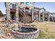 Beautiful backyard with a charming brick-lined pond and waterfall feature and access to upper deck at 1015 Graland Pl, Highlands Ranch, CO 80126