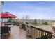 Spacious deck with stone pillars and outdoor seating, perfect for enjoying the expansive views at 1015 Graland Pl, Highlands Ranch, CO 80126