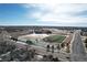 Aerial view of a neighborhood including a high school at 21589 E Union Pl, Aurora, CO 80015