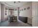 Well-lit bedroom with bay windows and built-in dresser at 21589 E Union Pl, Aurora, CO 80015