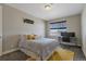 Cozy bedroom with desk, window seat, and patterned bedding at 21589 E Union Pl, Aurora, CO 80015