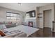 Living room with a stone fireplace and large sectional sofa at 21589 E Union Pl, Aurora, CO 80015