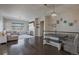 Open living area with hardwood floors, fireplace, and built-in shelving at 21589 E Union Pl, Aurora, CO 80015