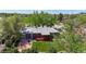 Aerial view of a property showing the layout of the house, yard, red wood deck and patio at 14157 E 26Th Ave, Aurora, CO 80011