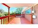 Wood deck with a view of the backyard and an exterior brick wall of the house at 14157 E 26Th Ave, Aurora, CO 80011
