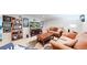 Basement featuring seating, wall art, and entertainment center at 14157 E 26Th Ave, Aurora, CO 80011