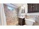 Bathroom with a tiled walk-in shower, a modern vanity, and a toilet with a decorative cabinet above at 14157 E 26Th Ave, Aurora, CO 80011